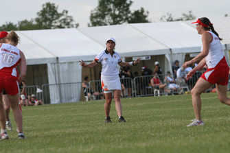 A female Touch referee controls an international game